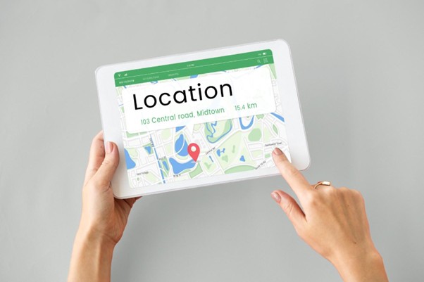 : Tablet showing map with location pin and address, illustrating turning procedure pages into local pages.