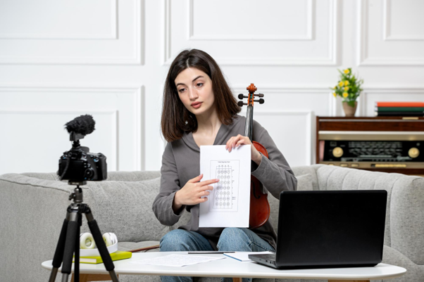 Woman creating a UGC video in front of the camera and laptop at home